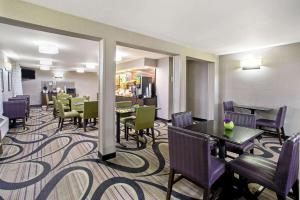 a hotel dining room with tables and chairs at La Quinta Inn by Wyndham Tucson East in Tucson