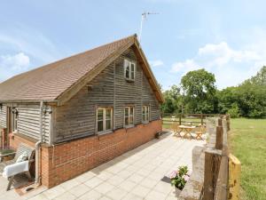 a barn conversion with a patio and a picnic table at Holmer Farm in Leominster