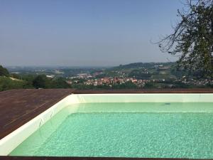 a swimming pool on the roof of a house at Agriturismo Minaldo in Dogliani