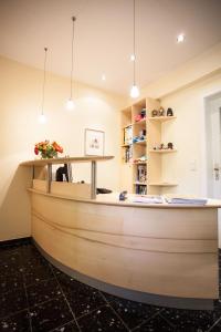 a wooden boat in a room with a table at Hotel Morgensonne in Badenweiler