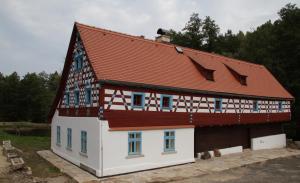 a house being constructed with a red roof at Statek Salajna in Salajna +54 photos