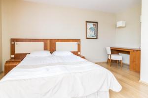מיטה או מיטות בחדר ב-Hotel Osada Karbówko Wellness & SPA