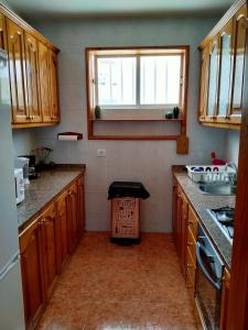 A kitchen or kitchenette at Martha`s Holiday Home