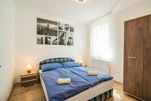 Posteľ alebo postele v izbe v ubytovaní Gemini Apartments Siófok I., III.