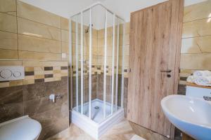 Kúpeľňa v ubytovaní Gemini Apartments Siófok I., III.