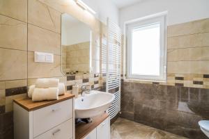 Kúpeľňa v ubytovaní Gemini Apartments Siófok I., III.