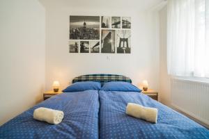 Posteľ alebo postele v izbe v ubytovaní Gemini Apartments Siófok I., III.