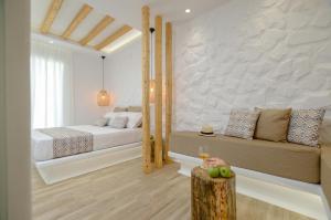 Postel nebo postele na pokoji v ubytování Naxian Spirit Inn