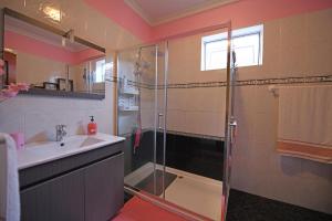 a bathroom with a shower and a sink at Ponta do Sol Villa in Ponta do Sol