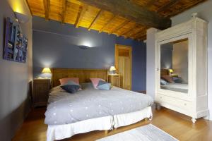 A bed or beds in a room at Les gerbes