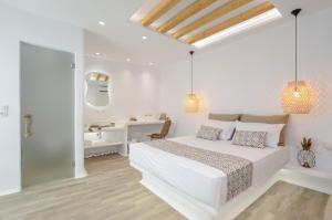 Postel nebo postele na pokoji v ubytování Naxian Spirit Inn