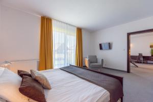 Posteľ alebo postele v izbe v ubytovaní Hotel Jan