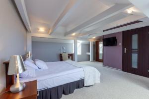 Posteľ alebo postele v izbe v ubytovaní Hotel Jan