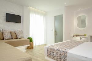 Postel nebo postele na pokoji v ubytování Naxian Spirit Inn