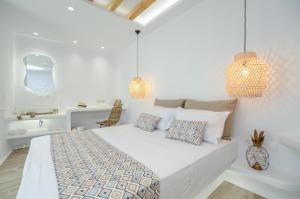 Postel nebo postele na pokoji v ubytování Naxian Spirit Inn