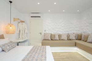 Postel nebo postele na pokoji v ubytování Naxian Spirit Inn
