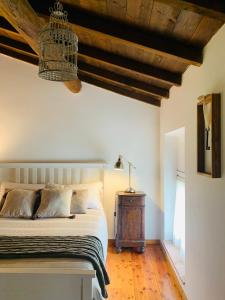 A bed or beds in a room at Relais Valpolicella B&B