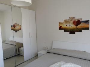 A bed or beds in a room at Casa Vacanza MariaTeresa