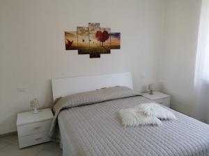 A bed or beds in a room at Casa Vacanza MariaTeresa