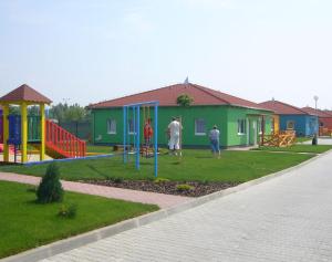 a group of people playing in a playground at Apartment MINT in Senec