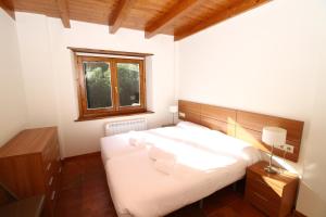Posteľ alebo postele v izbe v ubytovaní Apartamentos SNÖ Mont Romies Unhola