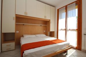 Postel nebo postele na pokoji v ubytování Residence Sole e Mare appartamenti