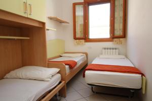 Postel nebo postele na pokoji v ubytování Residence Sole e Mare appartamenti