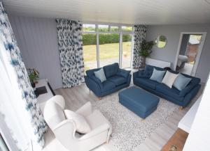 A seating area at Cornagower East Brittas Bay by Trident Holiday Homes