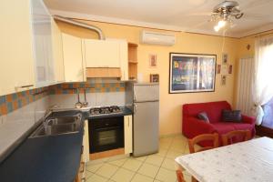Kuchyň nebo kuchyňský kout v ubytování Residence Sole e Mare appartamenti
