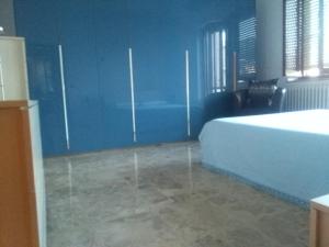 A bed or beds in a room at Appartamento in zona tranquilla a 400m dal mare