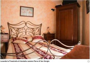 La Finestrella Di Montalto Locandaにあるベッド