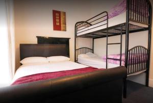 Postel nebo postele na pokoji v ubytování Sive Budget Accommodation