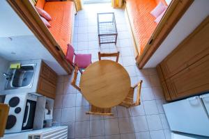 an overhead view of a kitchen with a table and chairs at Margarita Apartments in Kanali