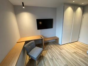 TV a/nebo společenská místnost v ubytování Ver'Olive