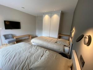 Letto o letti in una camera di Ver'Olive