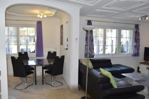 a living room with a couch and a table at Anna 1 in Grächen