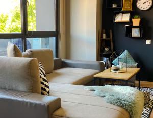 a living room filled with furniture and a window at City Center Apartments in Plovdiv