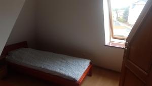 Postel nebo postele na pokoji v ubytování Alex Inn