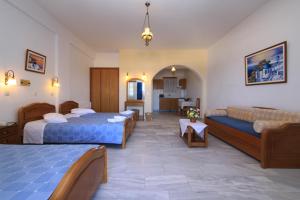 Postel nebo postele na pokoji v ubytování Aegean View Hotel + 37 fotografií