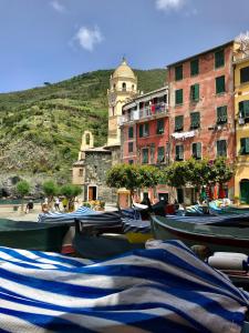 a group of umbrellas sitting on the ground next to buildings at Casa Memo in Vernazza