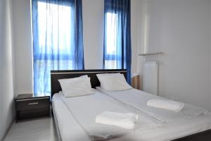 Cama o camas de una habitación en Senator Warsaw Apartments