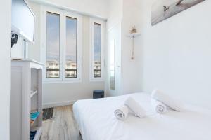 Ένα ή περισσότερα κρεβάτια σε δωμάτιο στο Sea View - Promenade des Anglais 1 Bdr