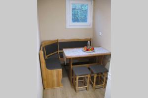 a small room with a table and chairs at Little House Ligia in Lygia