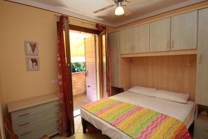Postel nebo postele na pokoji v ubytování Residence Sole e Mare appartamenti
