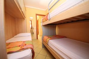 Postel nebo postele na pokoji v ubytování Residence Sole e Mare appartamenti