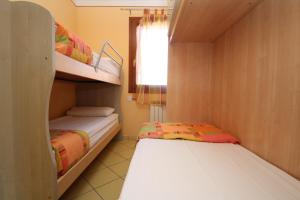 Postel nebo postele na pokoji v ubytování Residence Sole e Mare appartamenti
