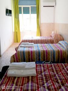 Krevet ili kreveti u jedinici u okviru objekta Hotel Diffuso Montedoro