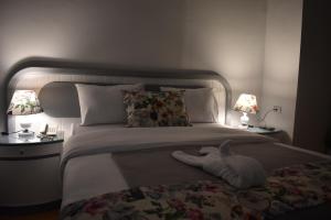 Postel nebo postele na pokoji v ubytování columbia sky city hotel