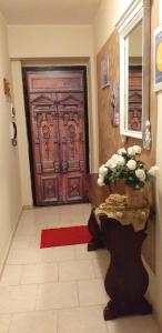 a door with a red rug in front of it at appartamento Claudia in Roccalumera