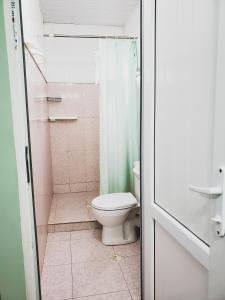 a bathroom with a toilet and a shower at Ureki House in Ureki
